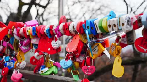 colorful-love-padlock-hanging-on-rail-at-namsan-tower-in-seoul,-south-korea