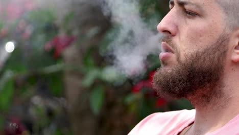 Closeup-of-bearded-caucasian-man-smoking-electronic-cigarette