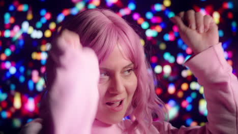 Pink-Haired-Party-Girl-Dancing-with-Colorful-Lights-in-Background