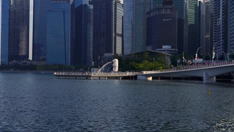 People-walk-Merlion-Park-with-Singapore-CDB-in-background