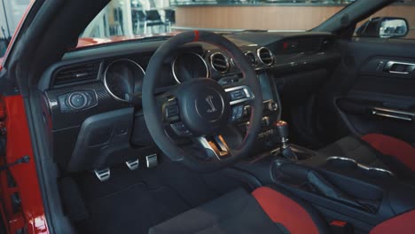 Red-and-Black-Leather-Interior-of-a-Ford-Mustang-Shelby-in-Showroom