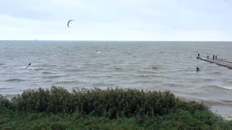 AERIAL:-A-Kiteboarders-is-Pulled-Across-Water-by-a-Power-Kite