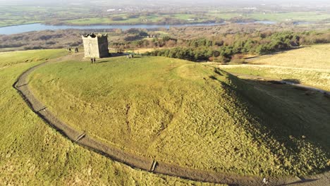 Rivington-hillside-tower-summit-Lancashire-reservoir-countryside-aerial-view-left-orbit