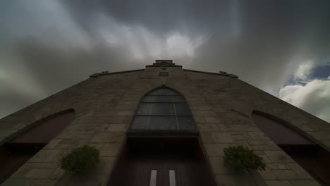 Time-lapse-of-a-historical-church-in-Ireland-during-the-day-with-passing-clouds