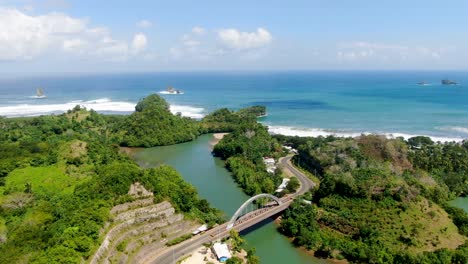 Scenic-coastal-road-and-Bajulmati-bridge-and-shore-of-East-Java-Indonesia-aerial