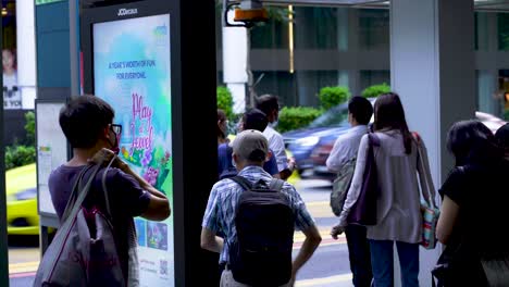 People-waiting-for-bus-at-Orchard-Road-bus-stop