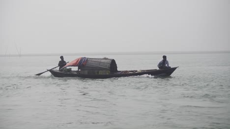 Motor-driven-small-boat-is-moving-ahead-through-the-river-water
