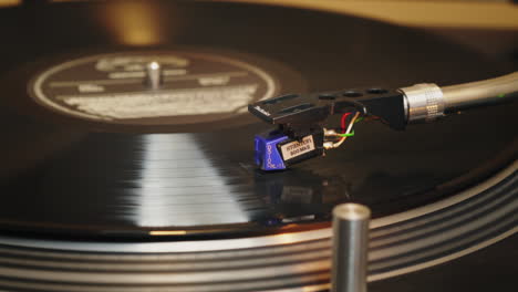 The-legendary-Technics-SL1200-MK2-playing-a-soul-record,-filmed-from-the-side-with-slider-movement