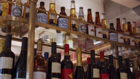 Various-beverage-alcohol-bottles-on-a-shelf-in-the-bar