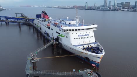 Stena-Line-freight-ship-vessel-loading-cargo-shipment-from-Wirral-terminal-Liverpool-aerial-view-zoom-out