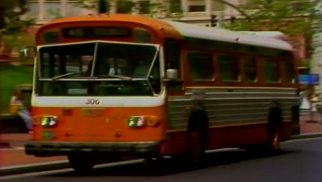 1981-OLD-STYLE-BUS-DEPARTING-TERMINAL-IN-DOWNTOWN-PORTLAND,-OREGON