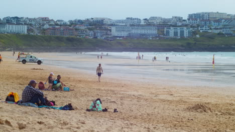 People-At-The-Lifeguarded-Beach-Of-Fistral-In-Cornwall,-United-Kingdom