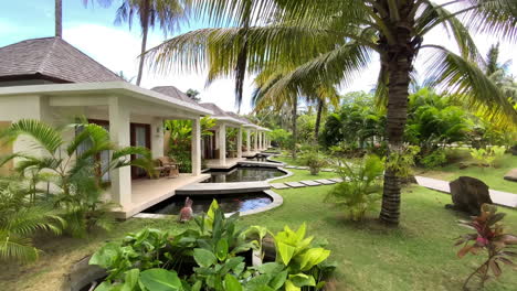 Row-Of-Luxury-Villas-With-Tropical-Gardens-In-Front-Of-Them-In-Kuta,-Lombok