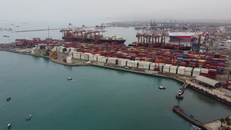 Drone-video-of-sea-port-in-Callao,-Peru,-on-a-cloudy-morning