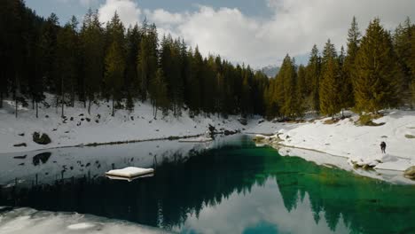 Landing-in-the-snow-to-show-the-beautiful-reflections-on-Caumasee