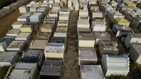 Aerial-dolly-shot-over-the-old-cemetery-in-Sint-Willibrordus-in-Curaçao-at-sunset