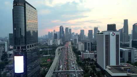 Jakarta-City-at-Sundown-as-Traffic-Builds-Below