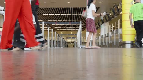 People-walking-at-the-airport-departure-terminal-hall-of-Brussels-Airport-during-summer---Belgium