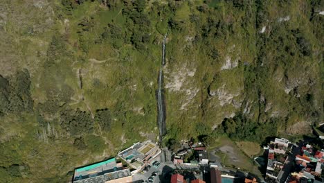 Cascada-de-la-Virgen,-Waterfall-Flowing-Down-On-Mossy-Cliff-To-Baños-de-Agua-Santa-City-In-Ecuador
