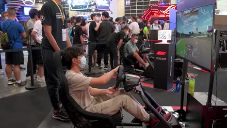 Participants-play-a-themed-racing-videogame-during-the-Anicom-and-Games-ACGHK-exhibition-event-in-Hong-Kong