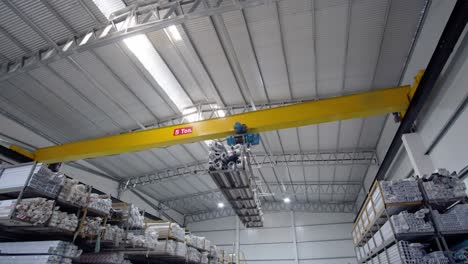 industrial-crane-carrying-aluminum-bars-inside-a-factory