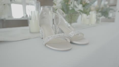 Wedding-bridal-shoes-sit-on-table-before-wedding