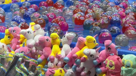 Catching-the-floating-balls-on-the-water-to-win-a-plush-toy,-popular-carnival-games-at-Ekka-Brisbane-Showgrounds,-Royal-Queensland-Show,-Australia