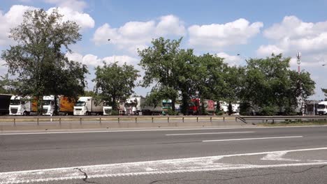 JIHLAVA,-CZECH-REPUBLIC---JUNE-3,-2018:-Fast-driving-cars-and-truck-parking-lot-at-Czech-D1-highway