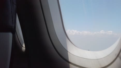 View-of-the-plane-wing-through-the-airplane-window