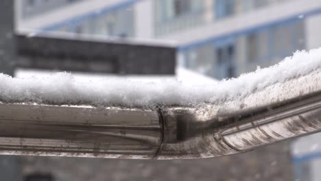 Snow-building-up-on-a-rail