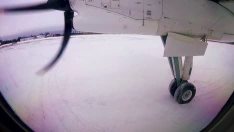 Sioux-Lookout-Ontario-Northern-Canada,-airplane-take-off-time-lapse,-snowy-small-gravel-airport-northern-Canada-Winter