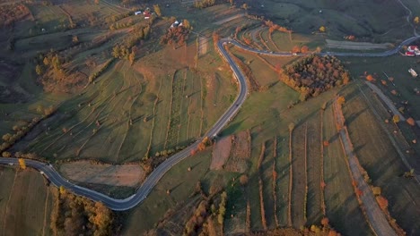 Aerial-fast-forward-footage-showing-cars-passing-by-a-road-in-Maramures-county,-Romania