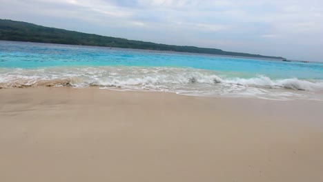 wavy-blue-waters-in-a-white-sand-beach