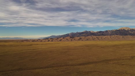 Great-Sand-Dunes-Mountains-Sunset-Aerial-Pan-Shot-4K