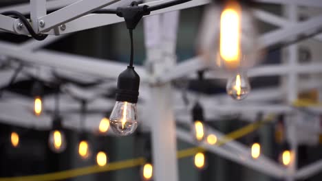 Static-shot-of-string-lights-on-a-grid-at-an-outside-eating-area-during-COVID-19-pandemic