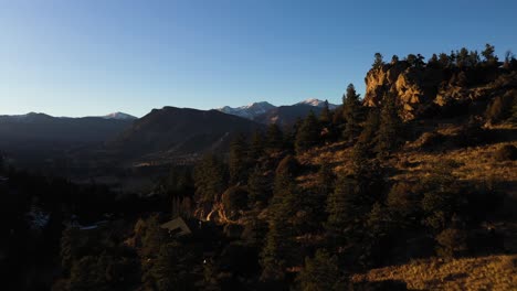 Mountain-Peak-Sunset-Aerial-Valley-Reveal-Shot-4K