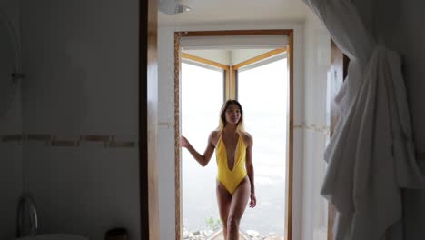 Beautiful-Girl-Model-in-Yellow-Bikini-in-Luxury-White-Beach-House-Shower