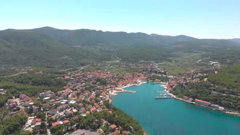 Jelsa-Town-on-Island-Hvar-in-Croatia,-Aerial-Drone-Midday-Establishing