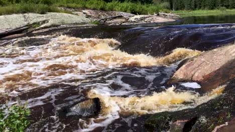Etomami-River-Onakamees-Rapids-Boreal-shield-river-in-summer-slow-motion-Northern-Manitoba-Canada
