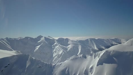 Fly-Over-Amazing-Snowy-Landscape-In-The-Romanian-Mountains---aerial-shot