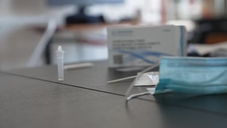 Cinematic-shot-of-a-coronavirus-self-test-kit-on-the-table