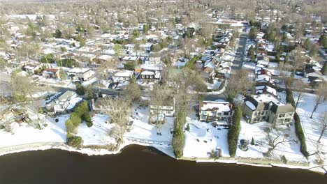 AERIAL---Residential-sector-in-a-very-snowy-winter-in-Ottawa,-Canada,-wide-shot
