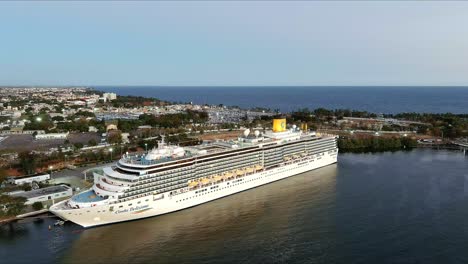 Costa-Deliziosa-luxuty-cruise-ship-moored-in-Sans-Souci-port-at-sunset,-Santo-Domingo