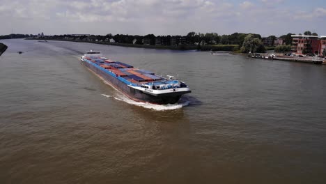 Aerial-View-Of-Belicha-Cargo-Container-Ship-Navigating-River-Noord