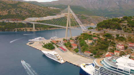 Aerial-View-Of-Luxury-Cruise-Ship-And-Superyacht-Near-Franjo-Tudman-Bridge-In-Dubrovnik,-Croatia