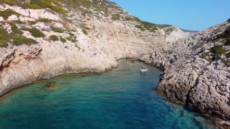 People-swimming-in-transparent-waters-in-Greece,-Korakonissi,-Zakynthos