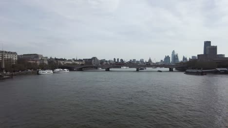 Pan-Right-View-From-Golden-Jubilee-Bridge-Over-River-Thames-Across-London-City-Skyline-On-12-April-2022