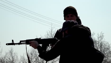 A-slow-motion-view-of-a-civilian-volunteer-is-trained-to-handle-a-Kalashnikov-assault-rifle-by-a-weapons-expert-during-the-Russian-invasion-of-Ukraine