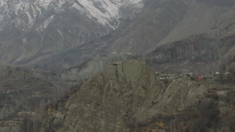 Aerial-Flying-Towards-Altit-Fort-Atop-Hillside-In-Hunza-Valley