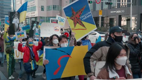 Ukrainians-and-Koreans-Protest-against-Russia's-intervention-in-Ukraine-walking-with-posters-in-the-Seoul-Downtown